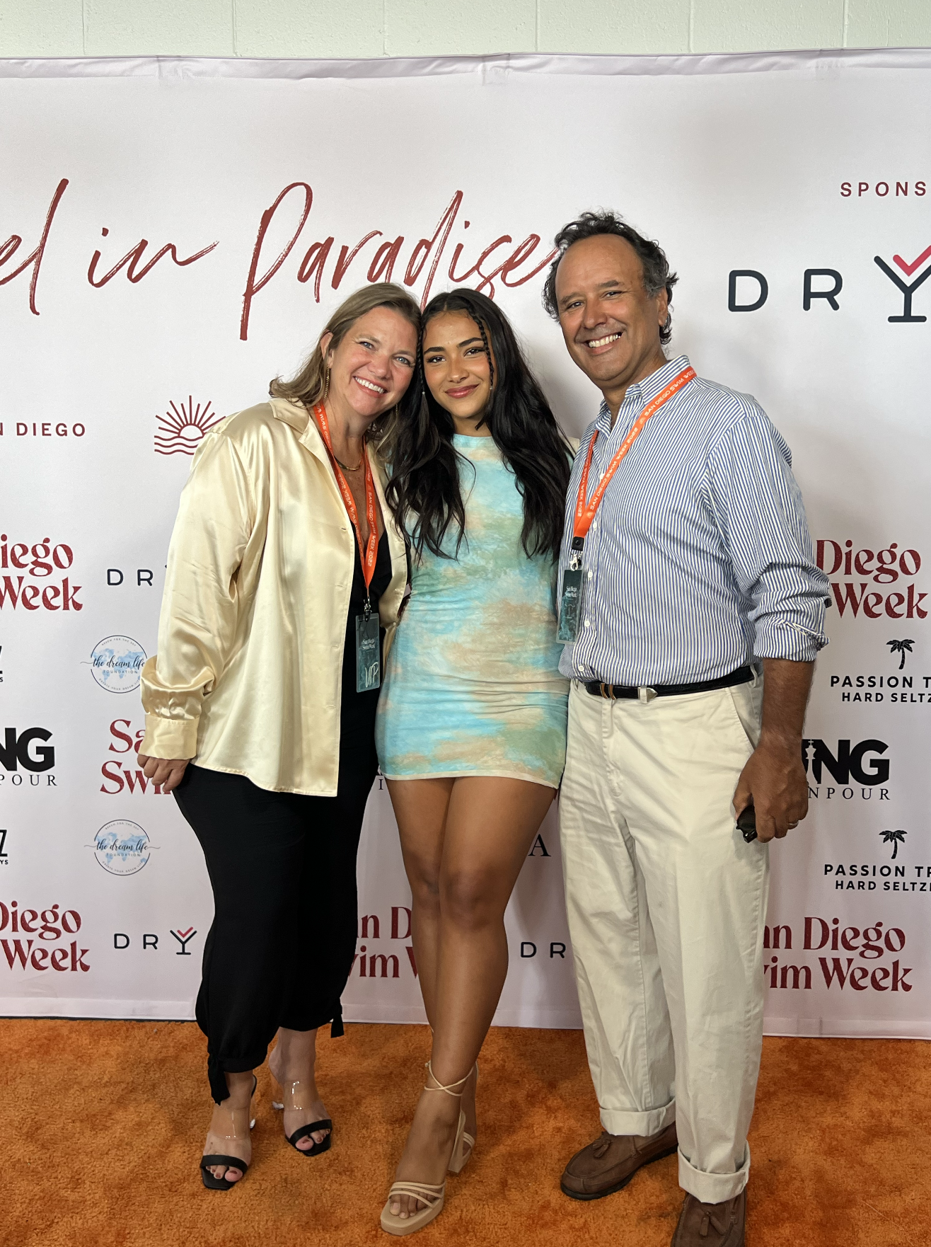 Sienna Mae Gomez poses with her parents at San Diego Swim Week fashion show